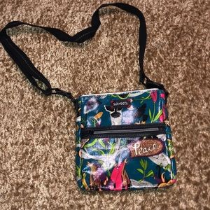 New never used Sakroots purse